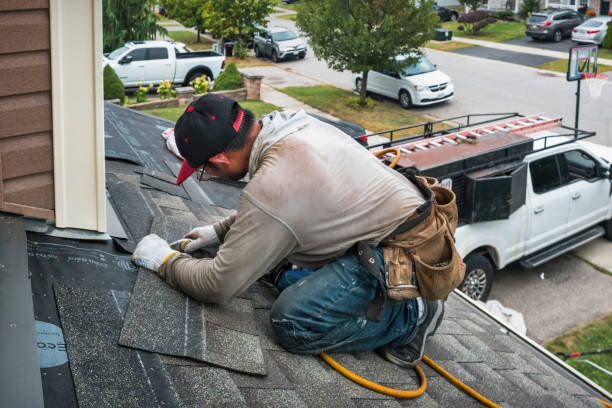 Professional Roof Leak Repair technician working in Brainard, NY